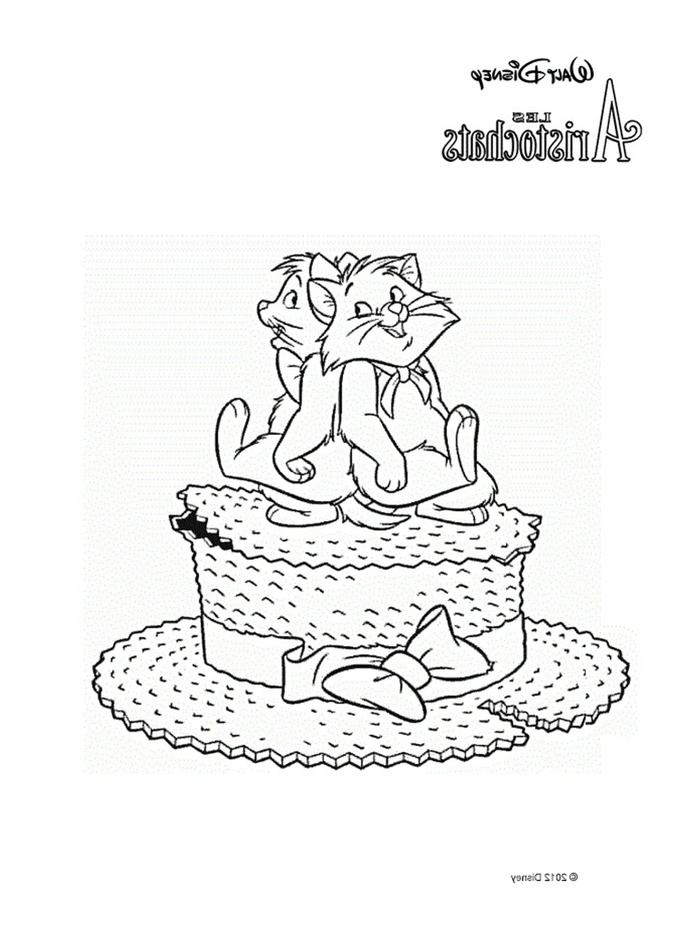  Two cats sitting on a big cake 