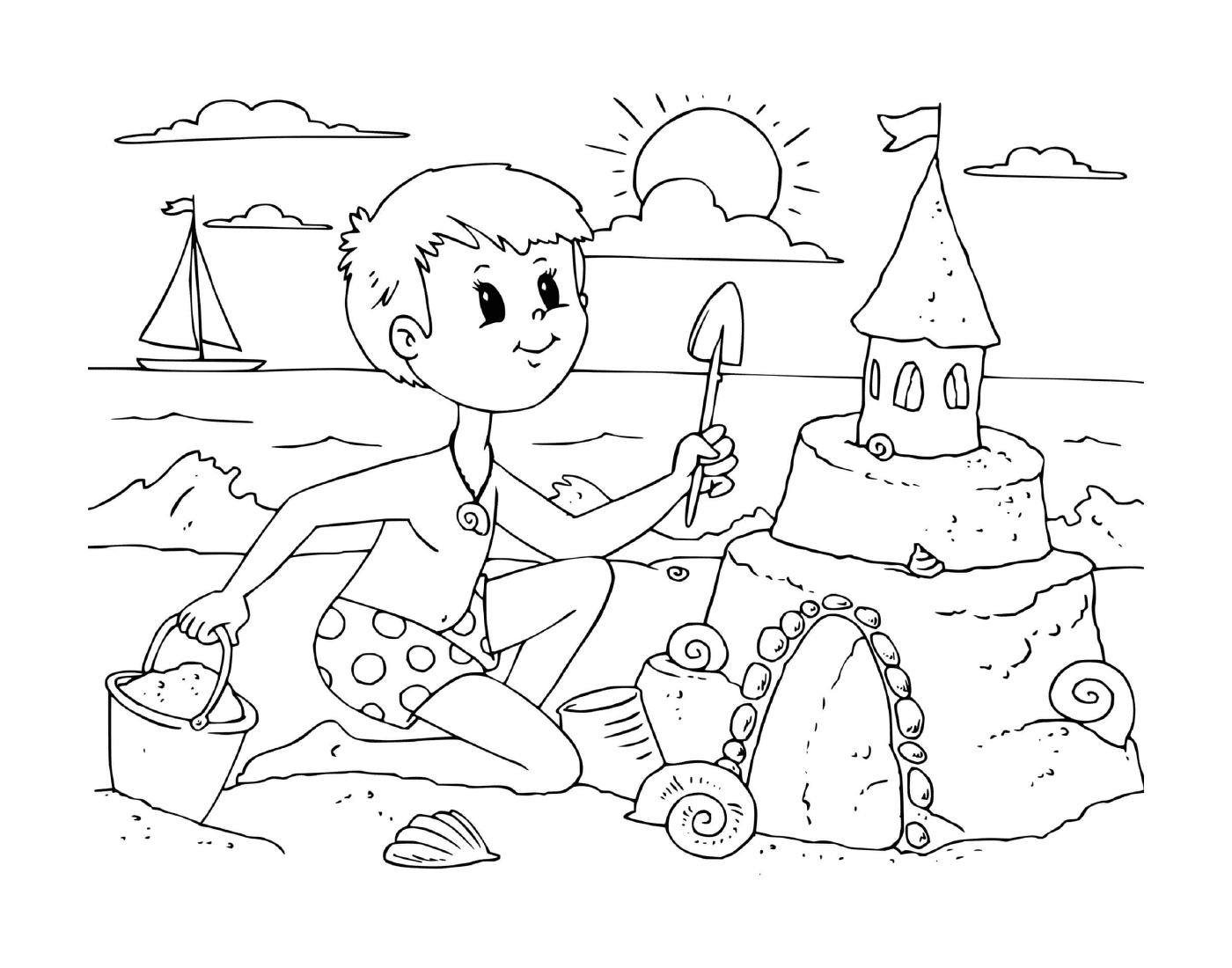  Un ragazzo costruisce un castello di sabbia sulla spiaggia 