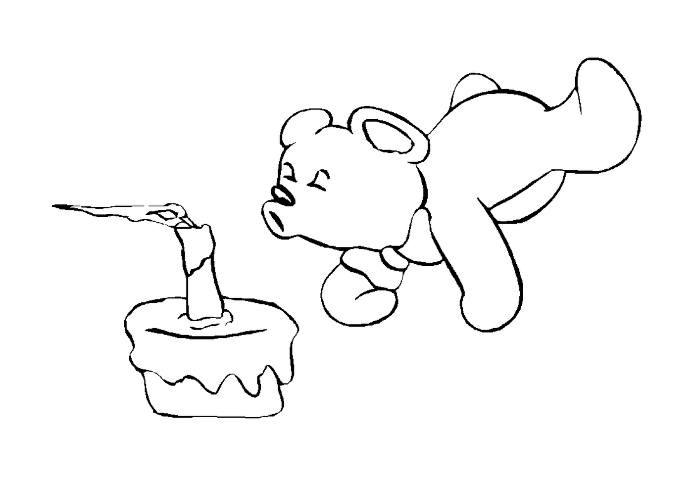  Bear looking at a cake 