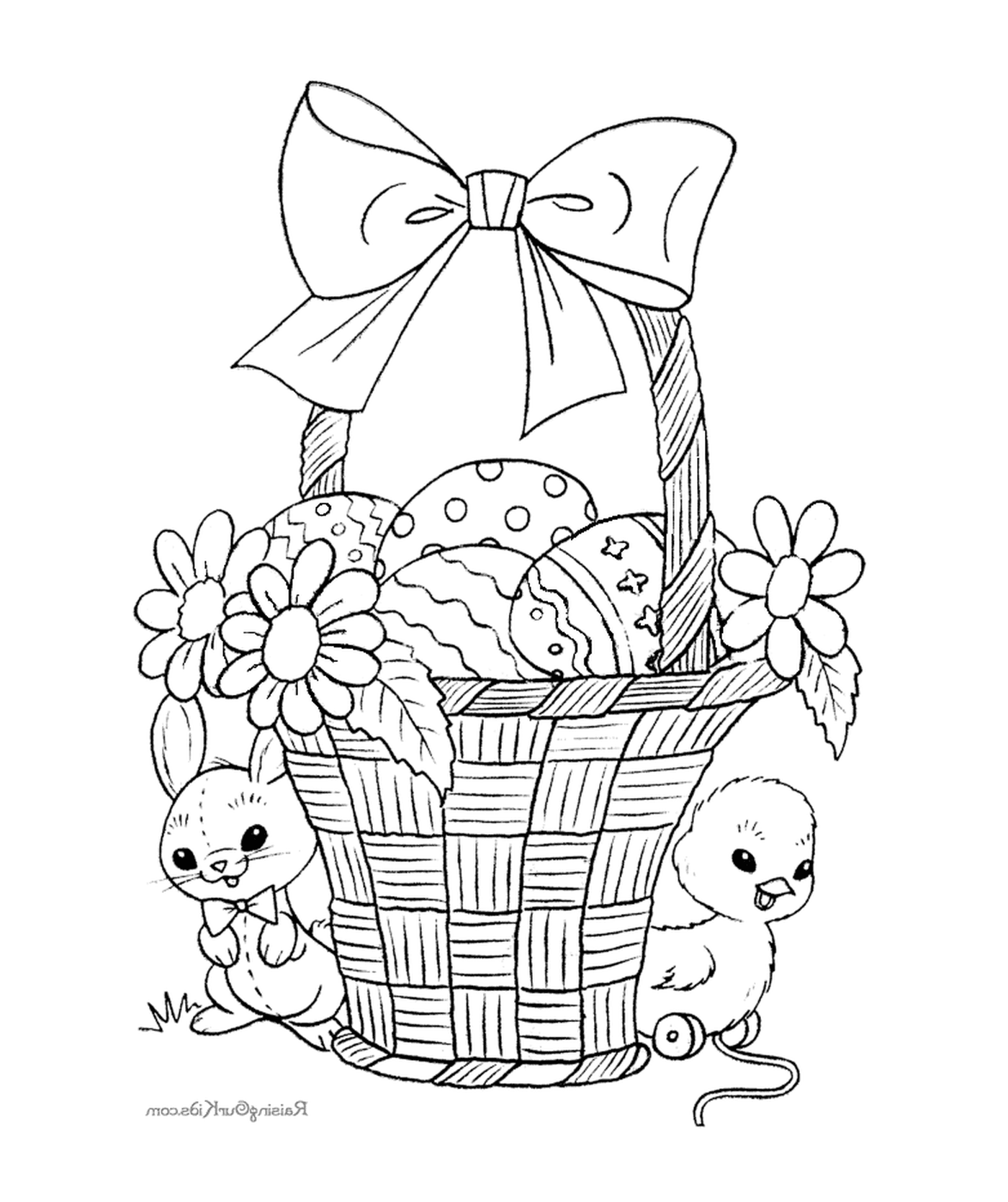  Ein Korb gefüllt mit Ostereiern und Kaninchen 