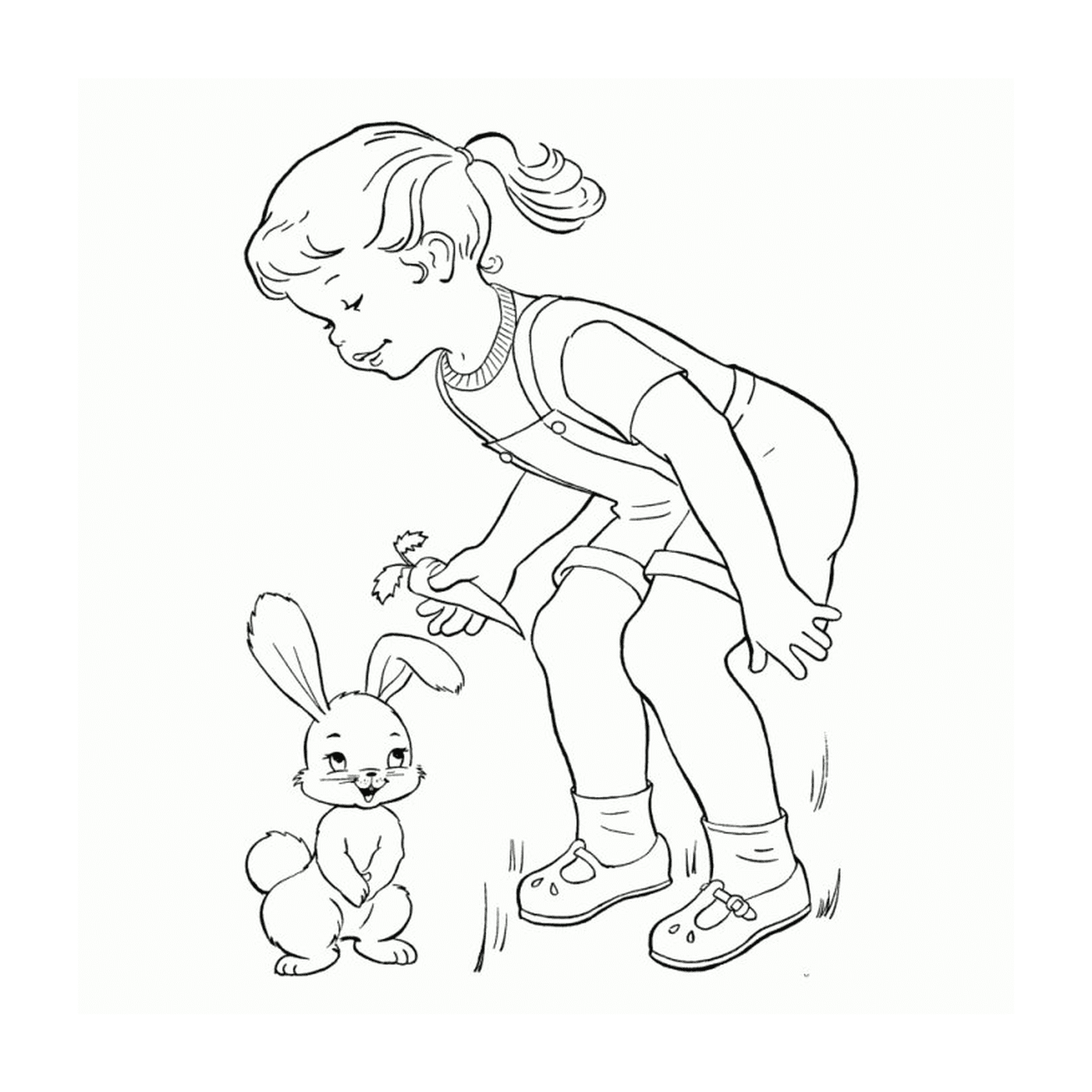  A little girl next to a little rabbit 