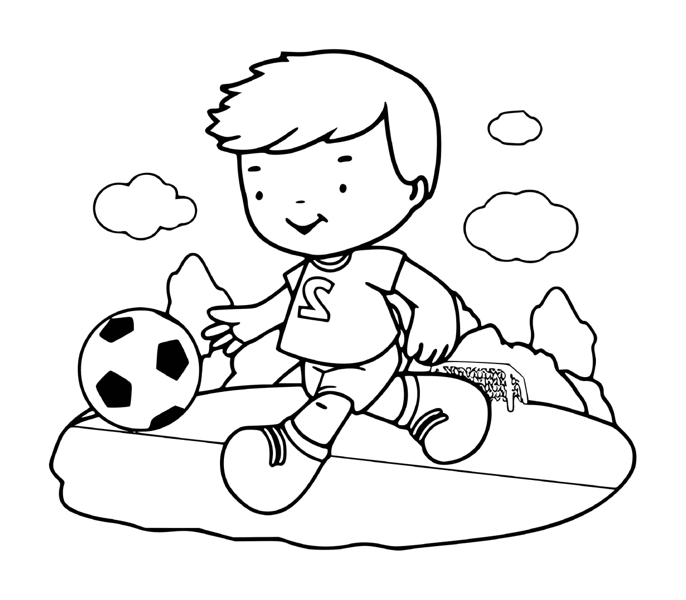  Un niño juega al fútbol con entusiasmo 