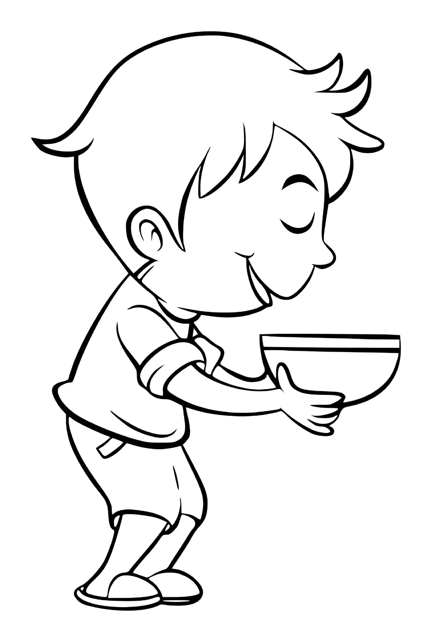  A boy eats broccoli soup with pleasure 