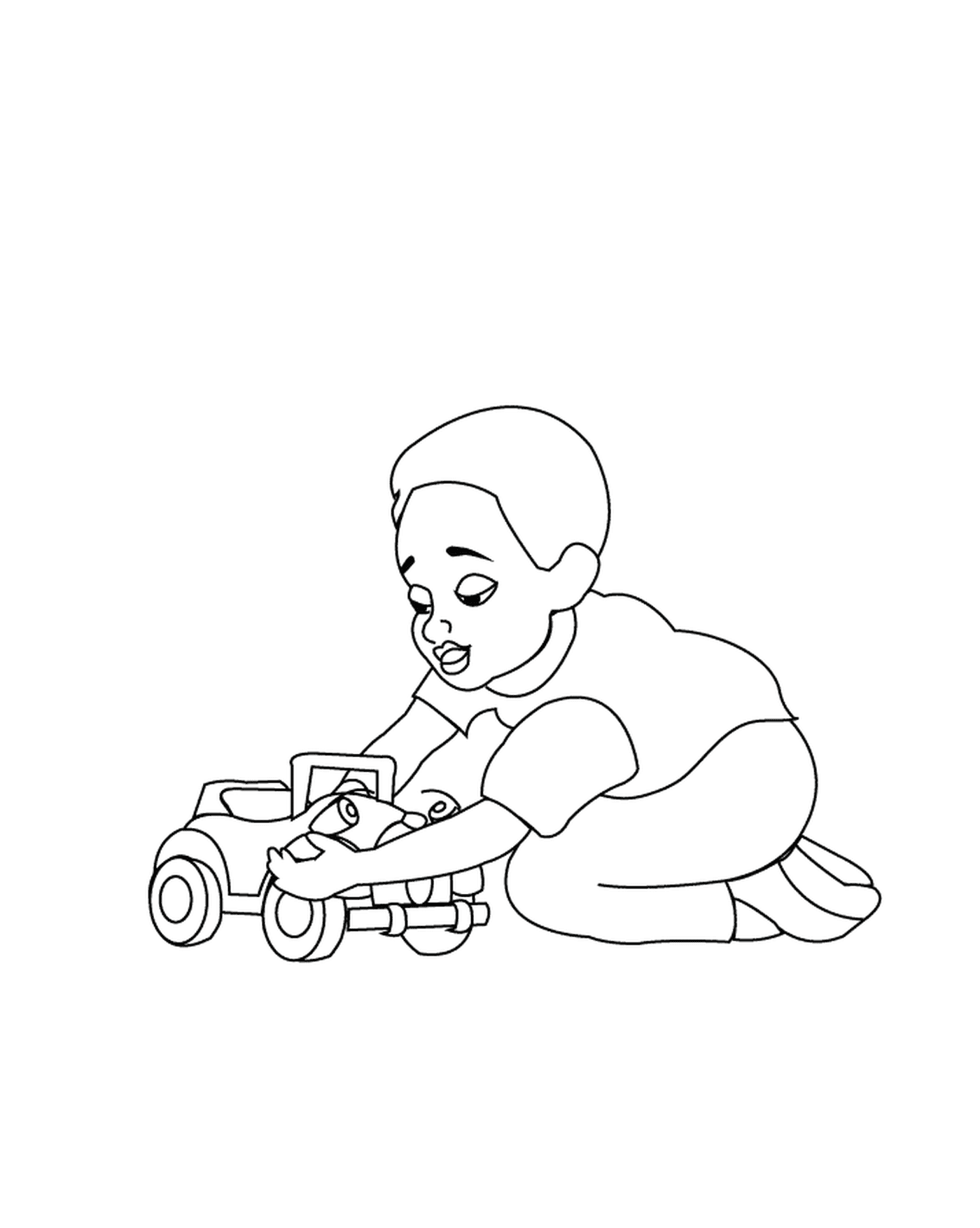  Un bambino gioca con una macchina giocattolo 