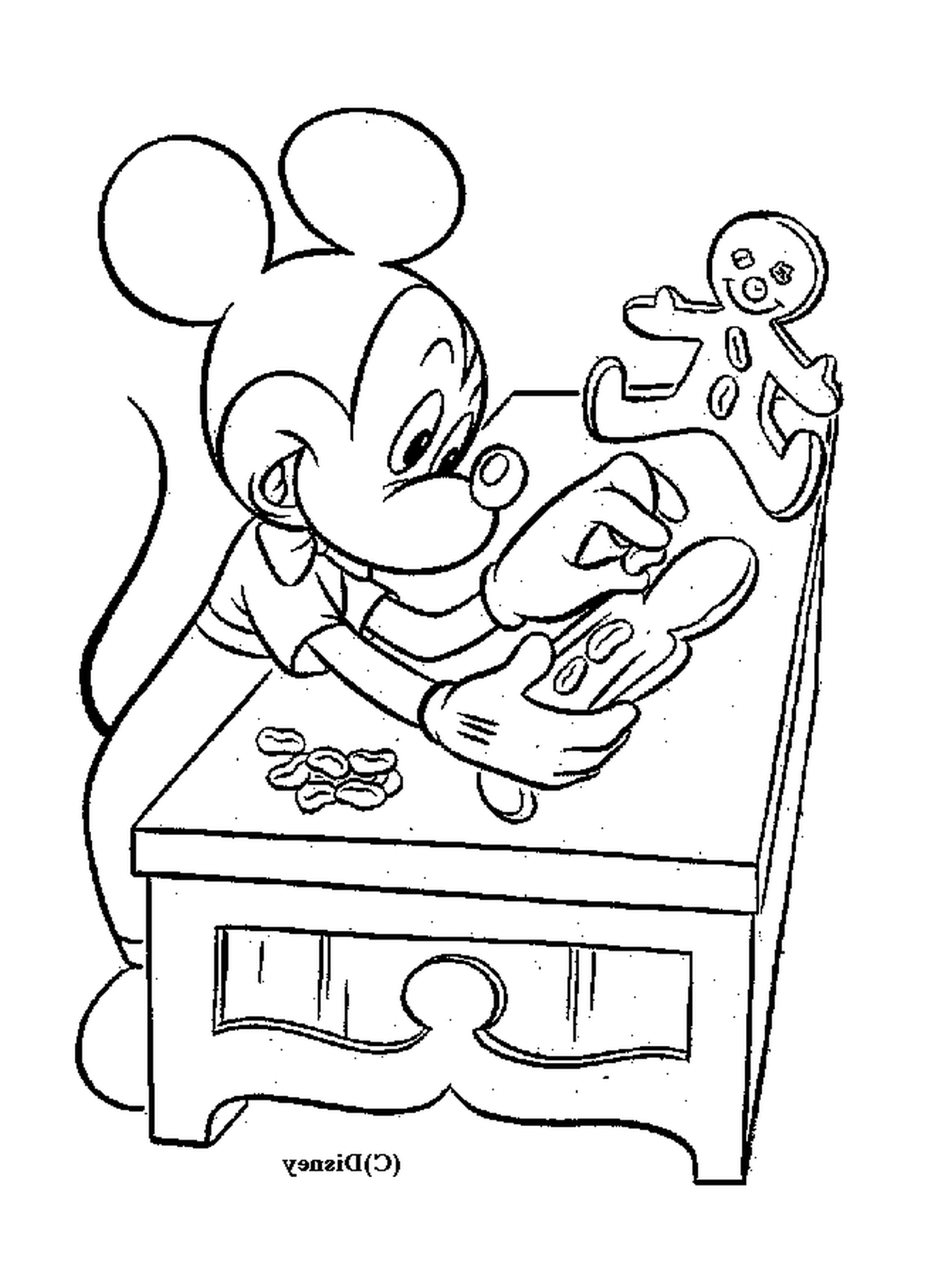  Mickey hace pasteles: sentado en una mesa con un hombre hecho de pan de jengibre 