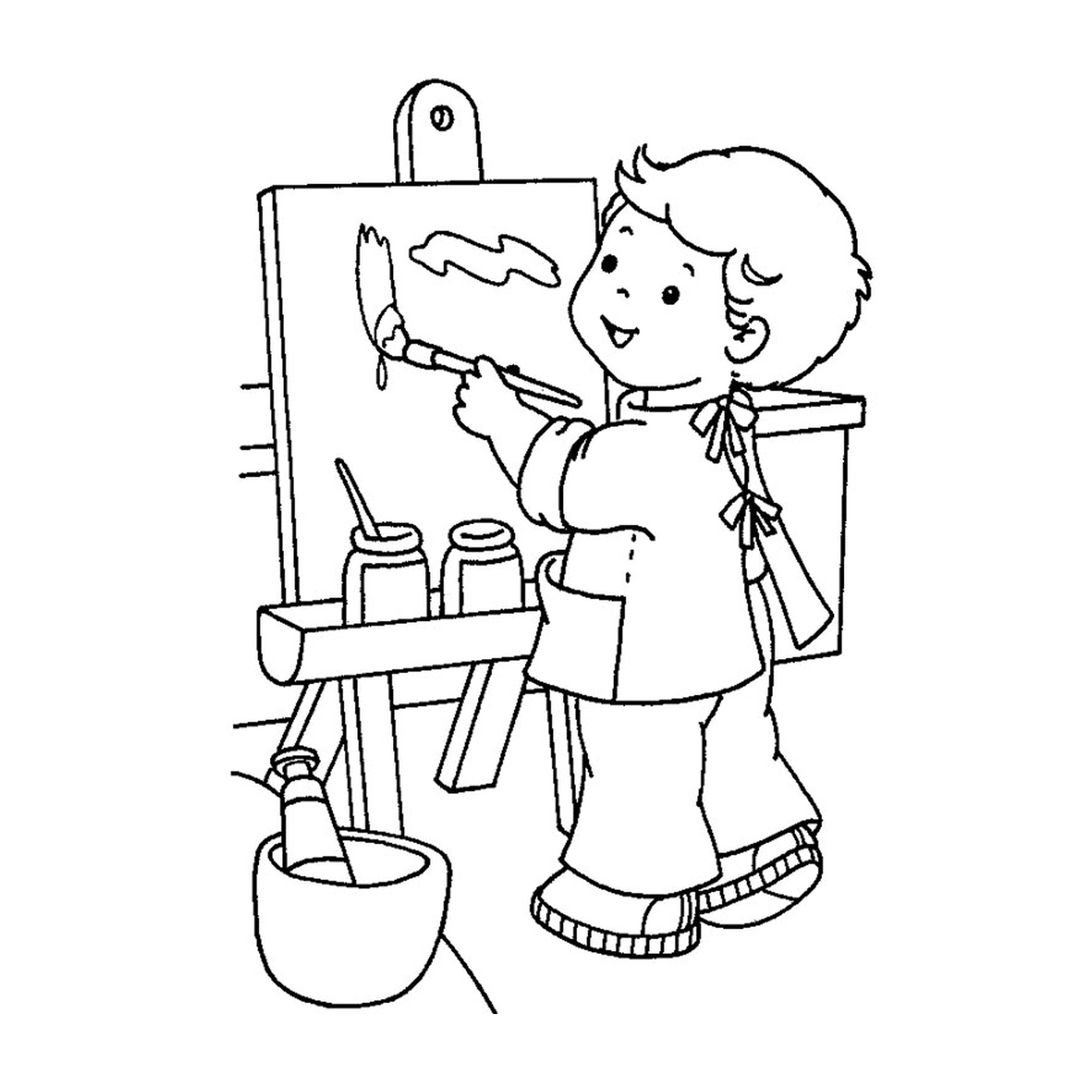  Мальчик рисует на мольберте 