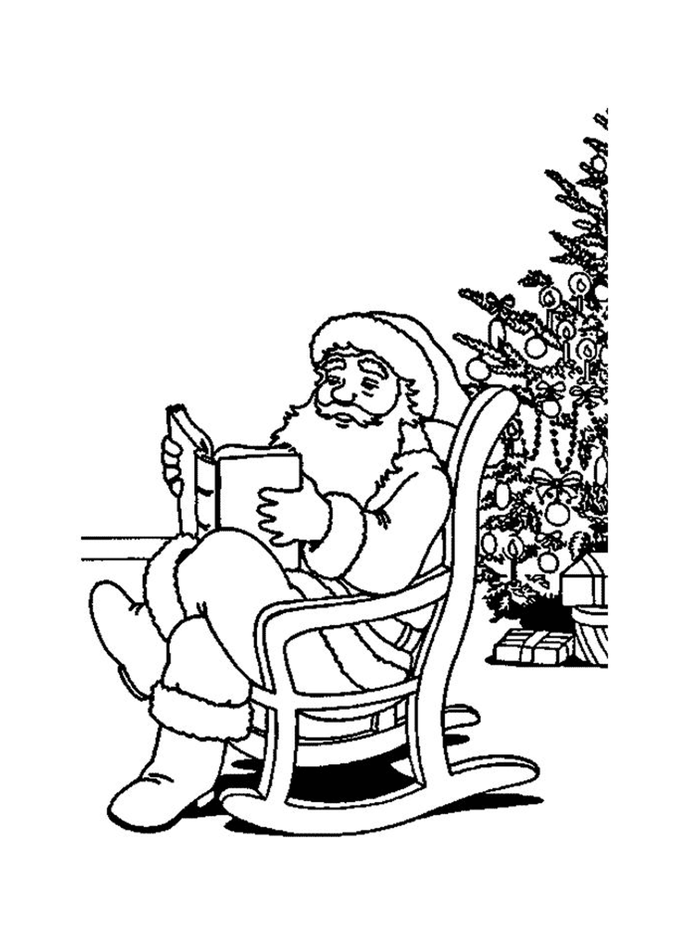  Санта читает книгу у дерева 