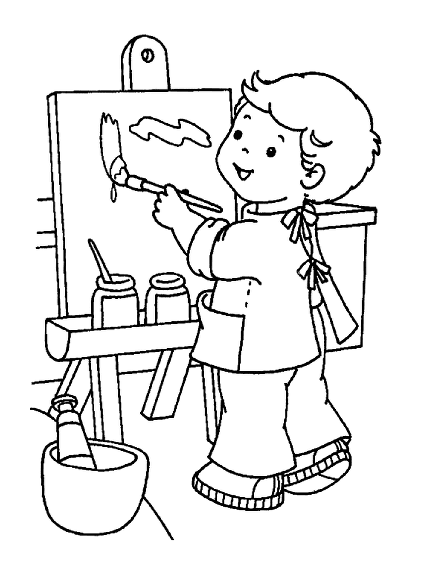 A little boy painting at school 