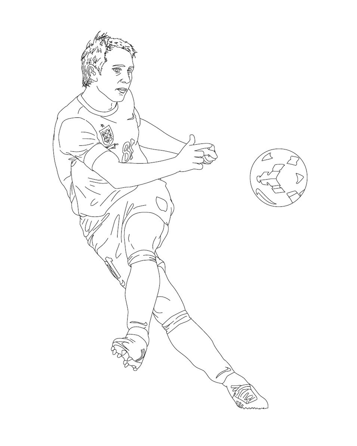  Un hombre pateando en una pelota de fútbol en un campo 