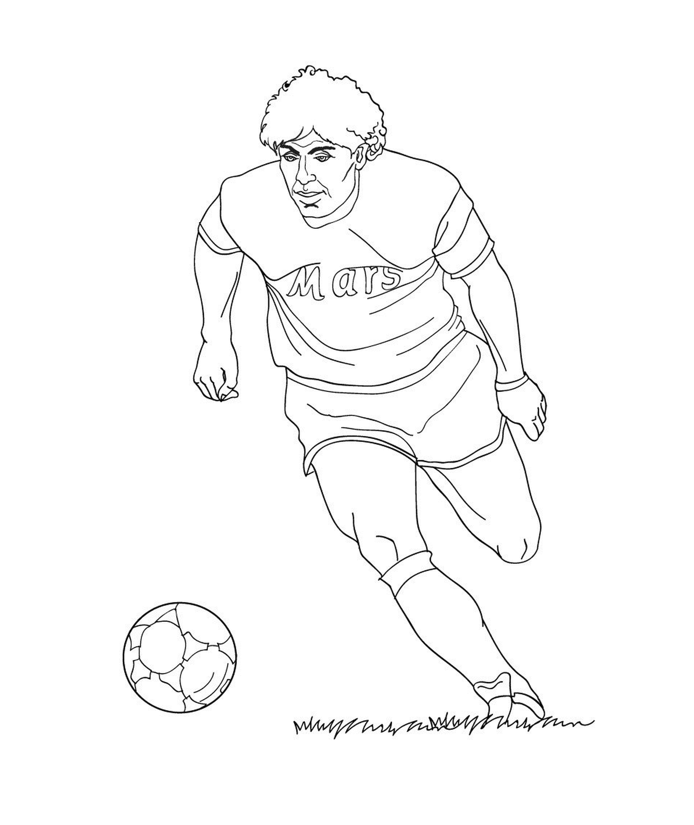  Ein Fußballspieler tritt in einen Ball 