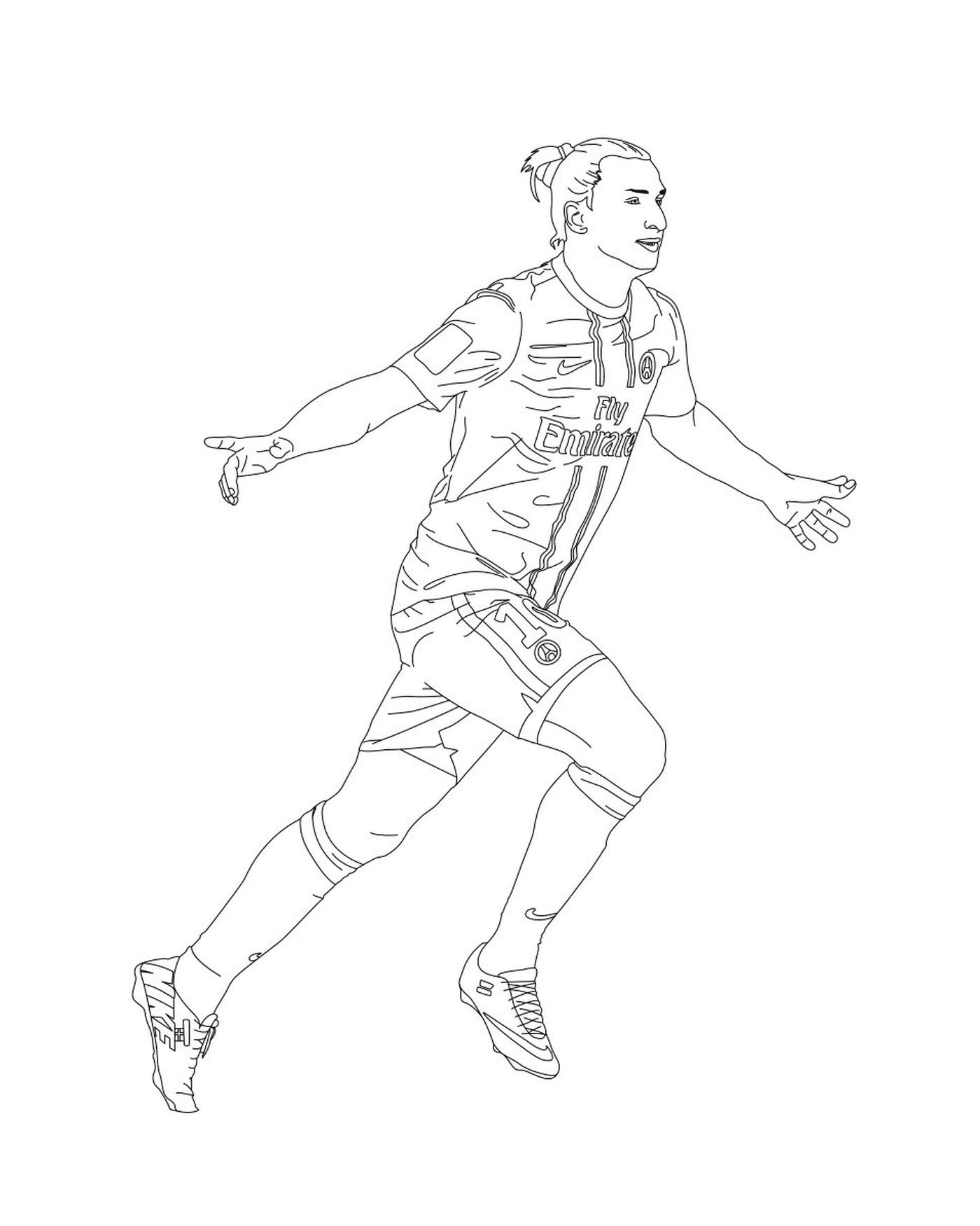  Un jugador de fútbol corriendo con la pelota 