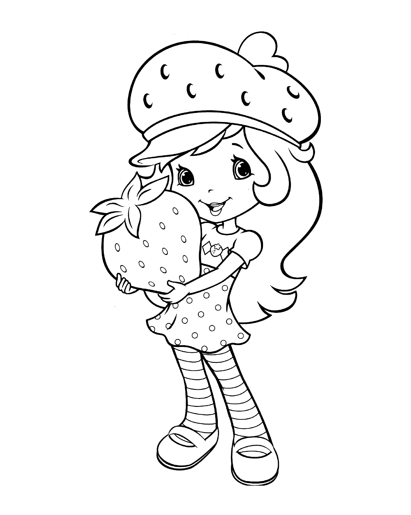  Ein Mädchen, das eine Erdbeere hält 
