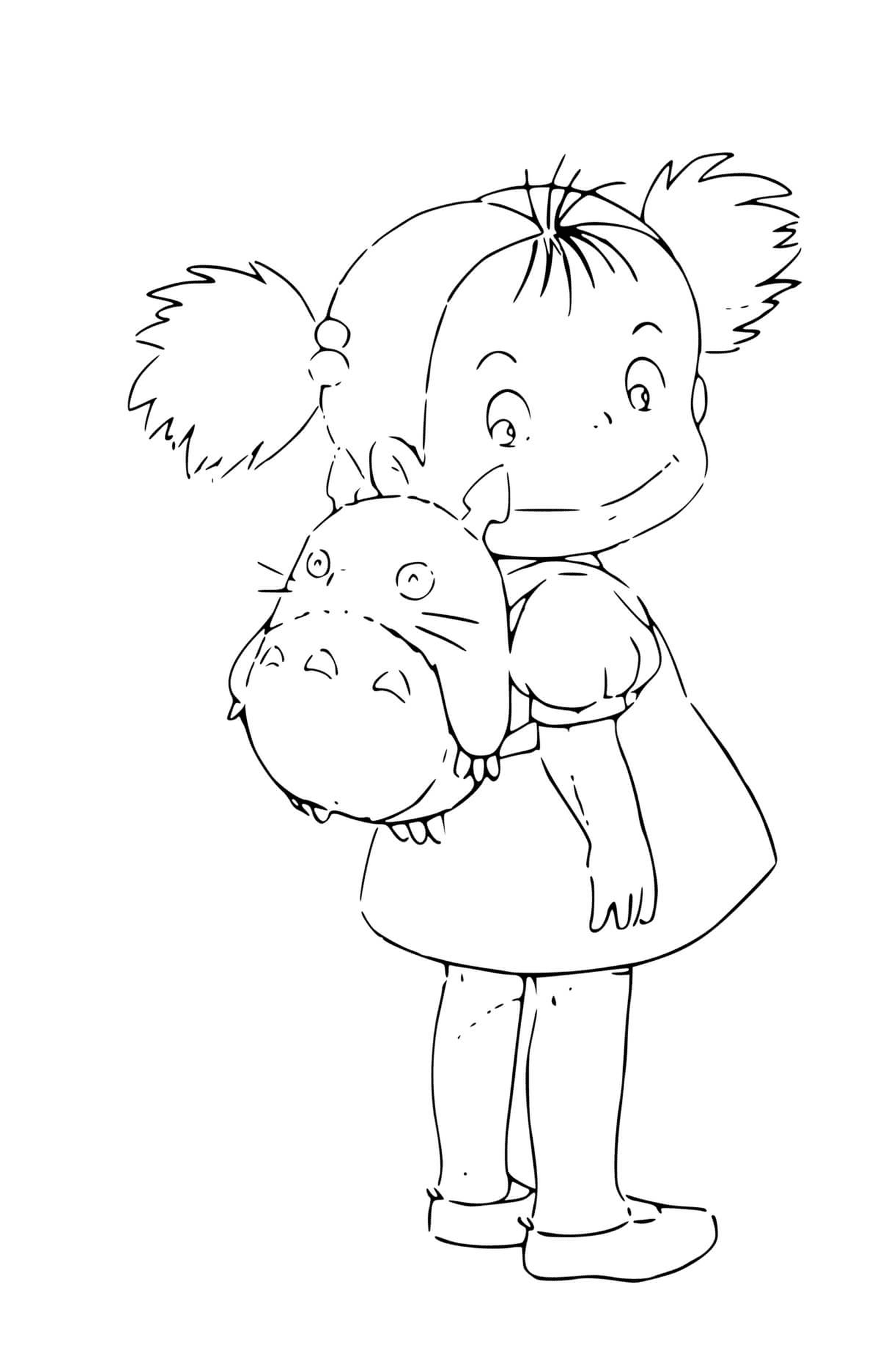  Маленькая девочка держит плюшевое животное 