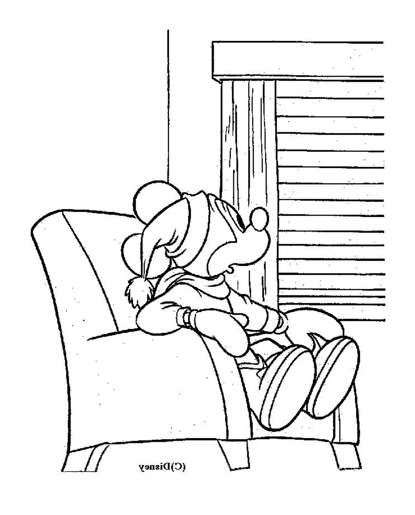  Mickey Maus sitzt auf einem Stuhl 